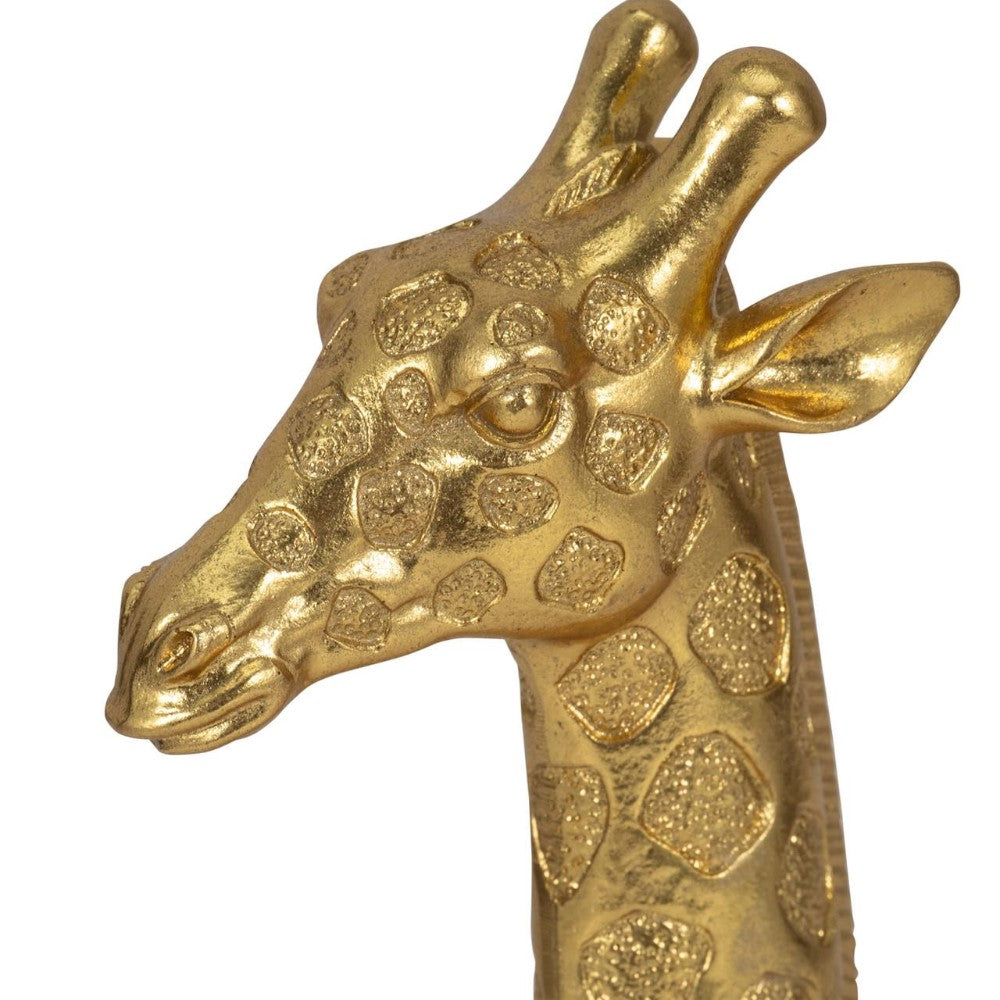Golden giraffe bust with textured detail.
