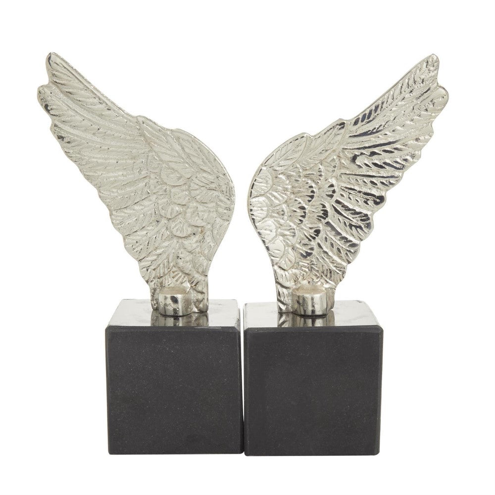 Silver wing sculptures on black square bases.