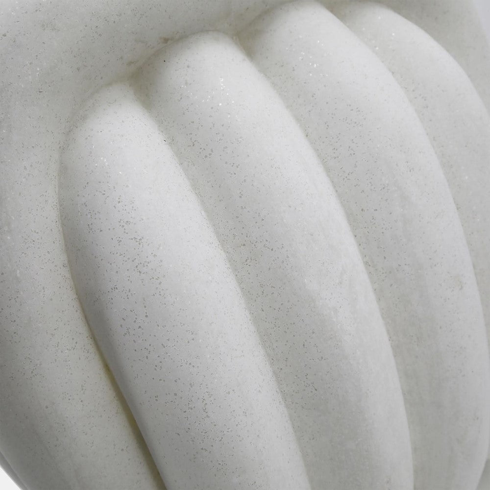Close-up of a textured white gourd or pumpkin surface.