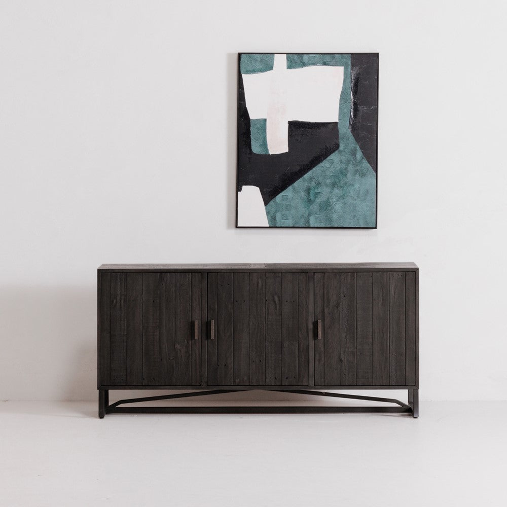 Dark wooden console under abstract art on a white wall.