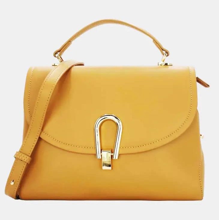 Yellow handbag with gold clasp and top handle.