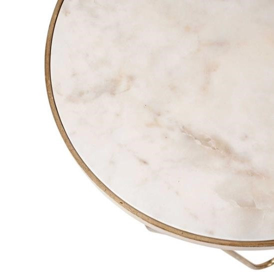 Round marble table with a thin metal edge.