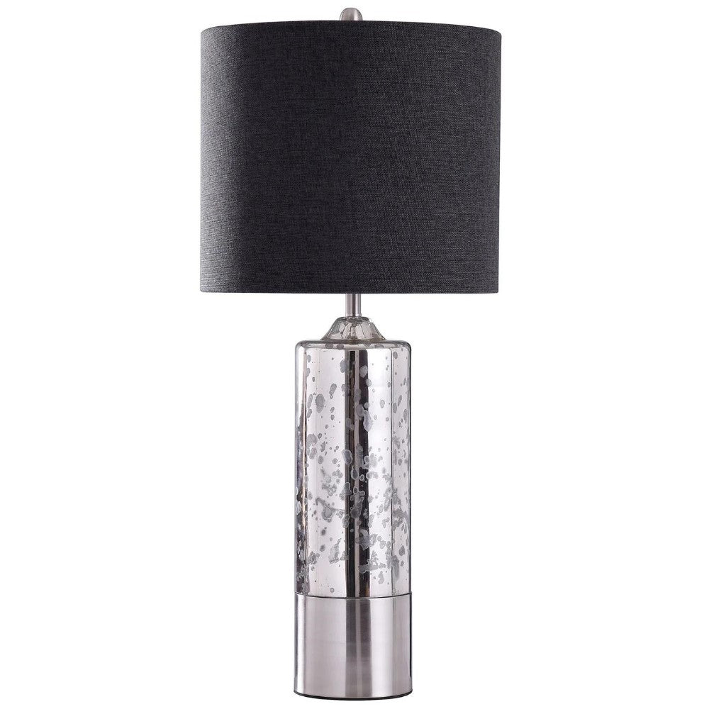 Modern lamp with a mercury glass base and a black drum shade.
