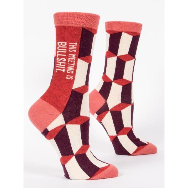 Geometric socks with humorous text.