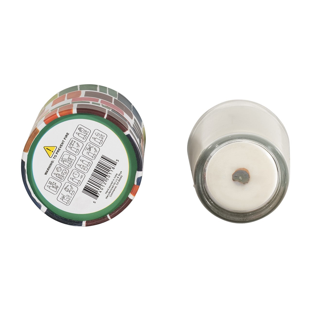 Two cylindrical candles, colorful and plain, showing bases with warnings.