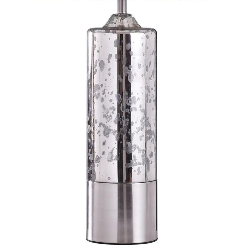 Metallic silver cylindrical lamp with speckled design.