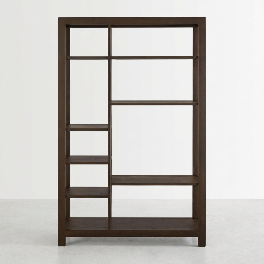 Dark wooden bookshelf with asymmetrically arranged shelves.