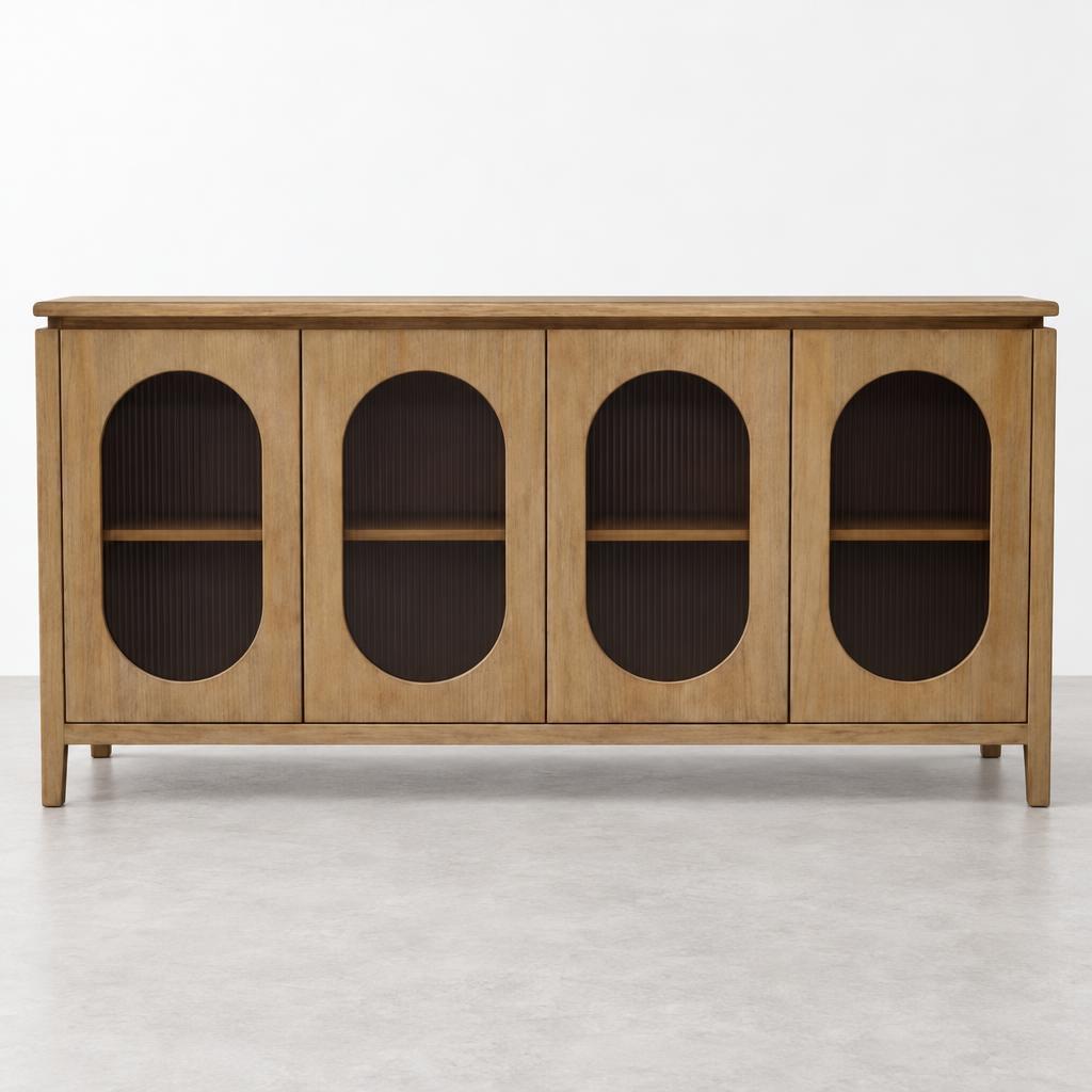 A wooden sideboard with four arched, dark-paneled doors stands against a white wall.