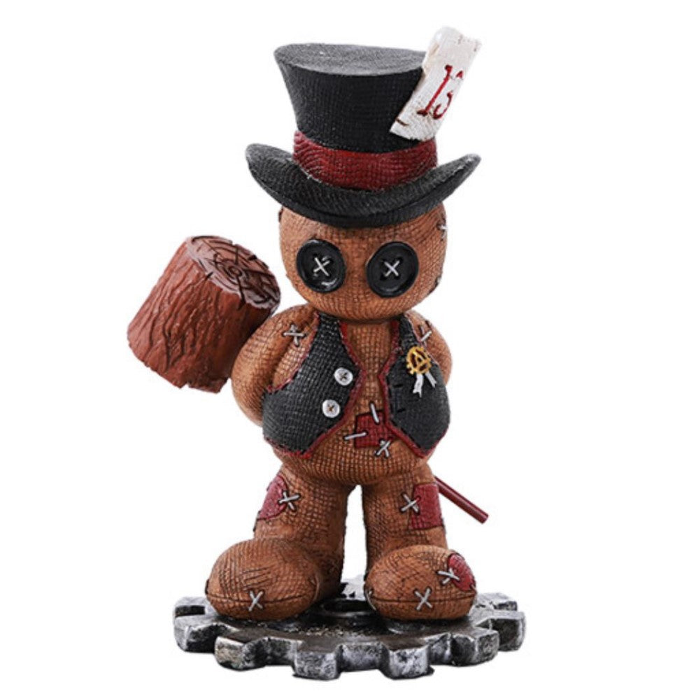 Patchwork figure with a top hat, holding a wooden mallet.