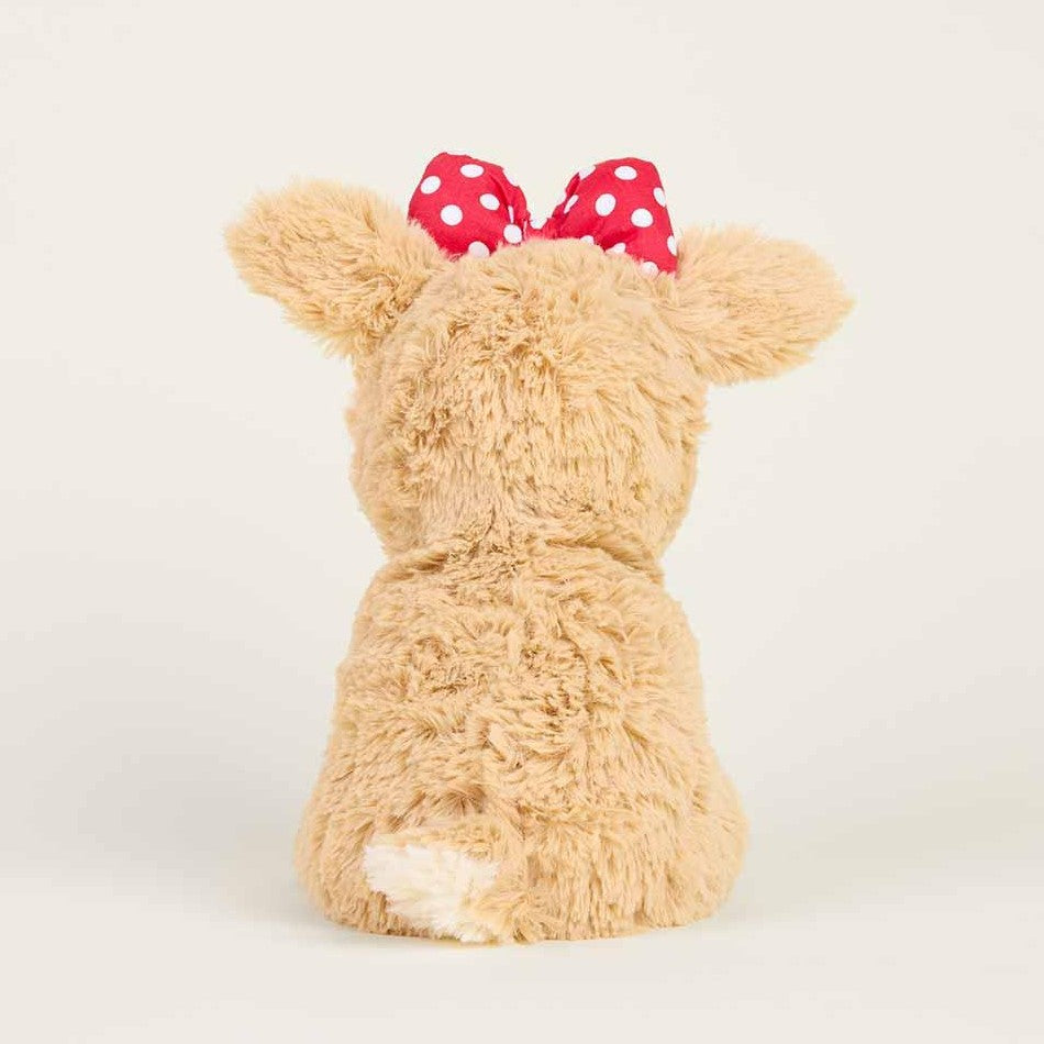 Fluffy teddy bear with red polka dot bow from behind.
