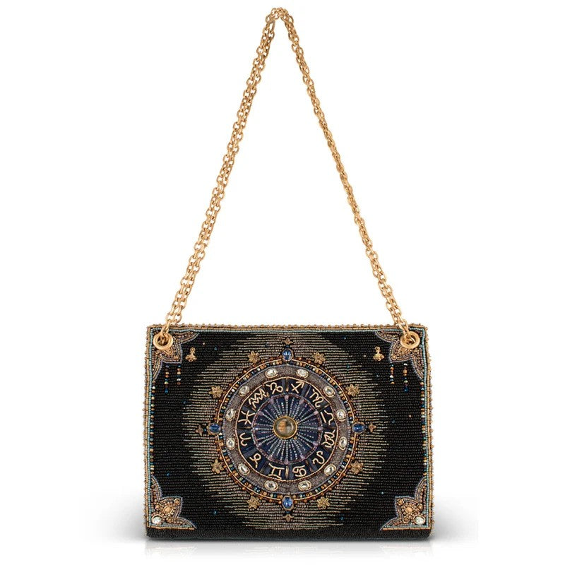 Beaded zodiac-themed purse with gold chain.