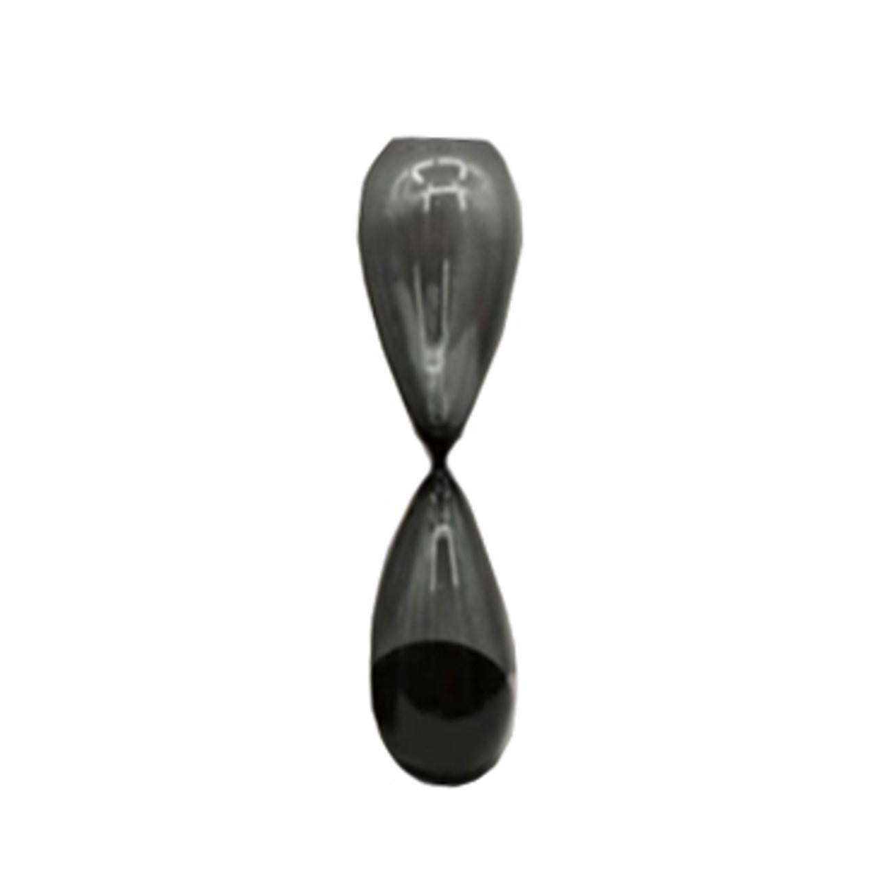 A reflective, sleek black hourglass on a white backdrop.