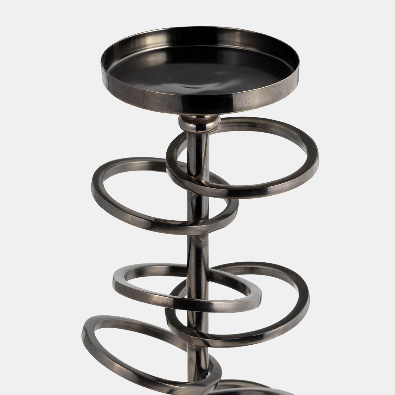 Metal stand with spiraling rings and a shallow round top.