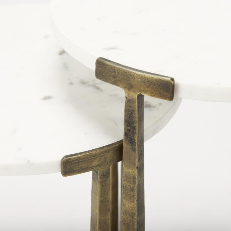 Marble and brass nesting tabletops with elegant design.