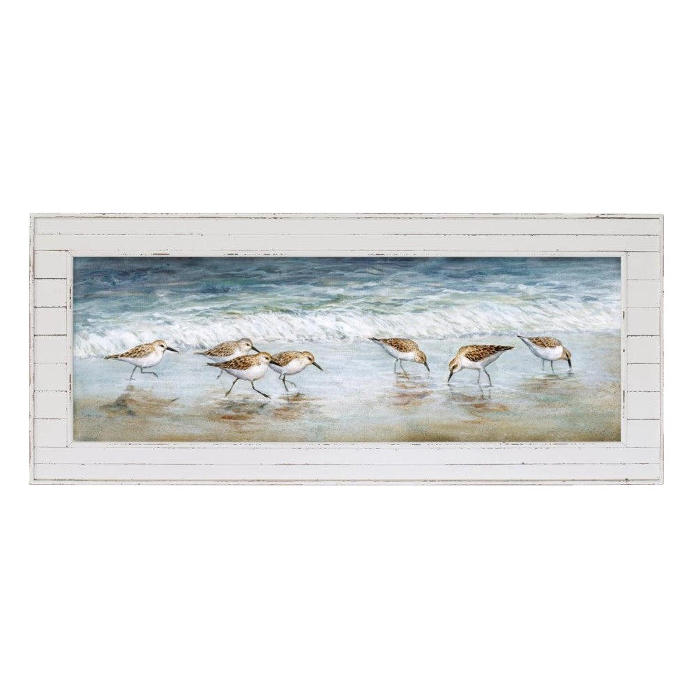Painting of shorebirds at the beach in a rustic white frame.