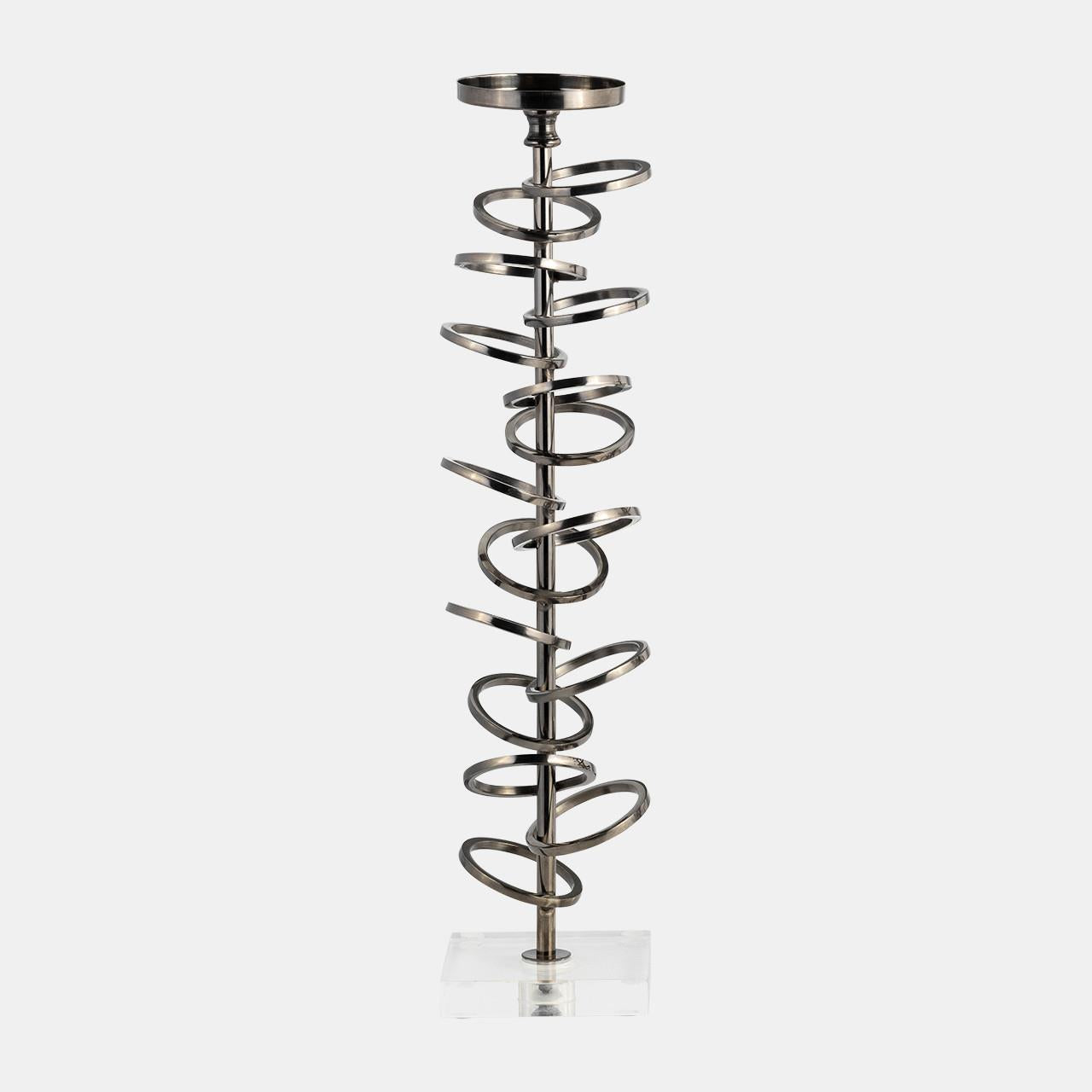 Spiral metal sculpture on a clear base.