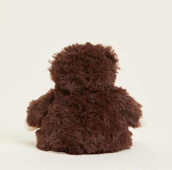 Fluffy brown plush toy facing away.
