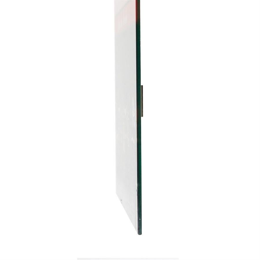 Side view of a thin glass panel on a white background.