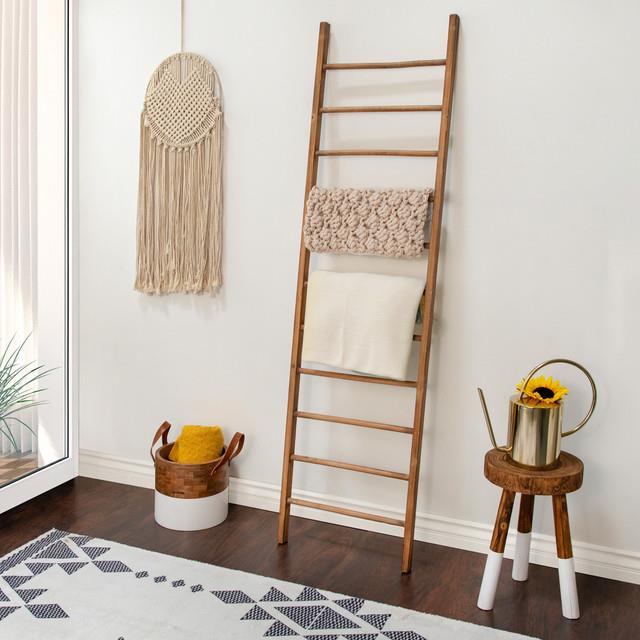 Cozy room with ladder, macramé, stool, and sunflowers.