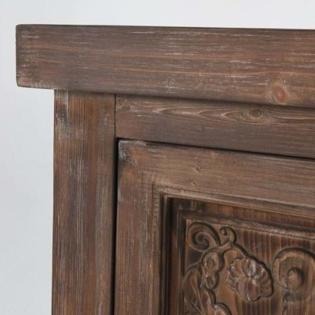 Ornate wooden furniture with floral carvings.