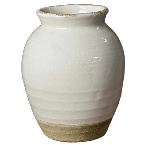White ceramic pot with a textured beige base and a slightly curved shape.
