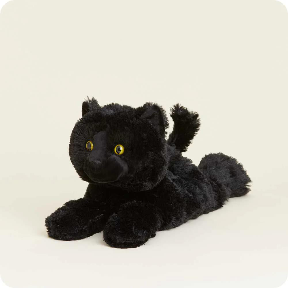 Fluffy black cat plush with bright yellow eyes.