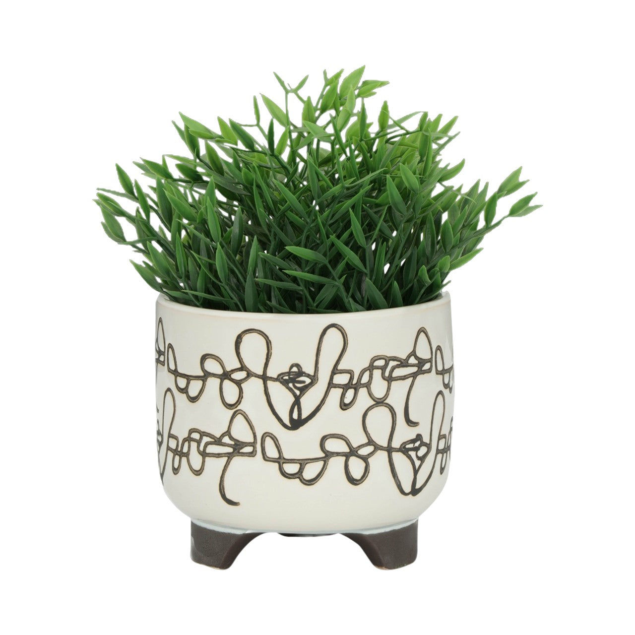 Green plant in a patterned white pot with legs.
