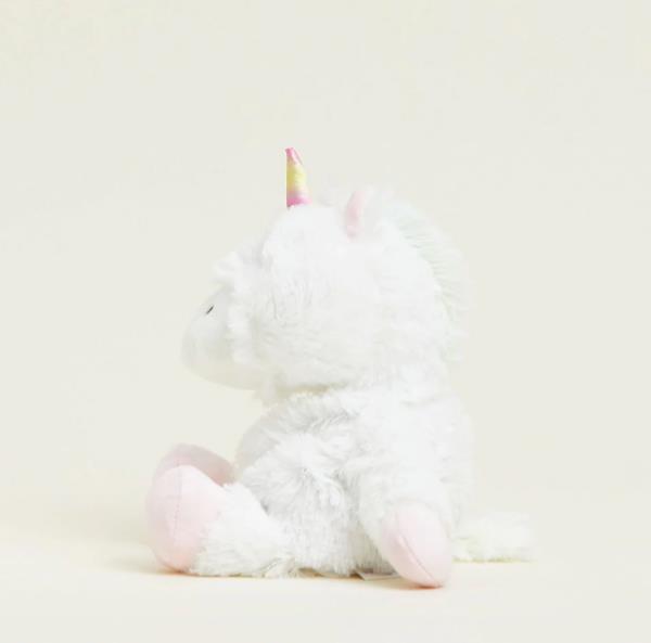 Fluffy white unicorn plush with a colorful horn.
