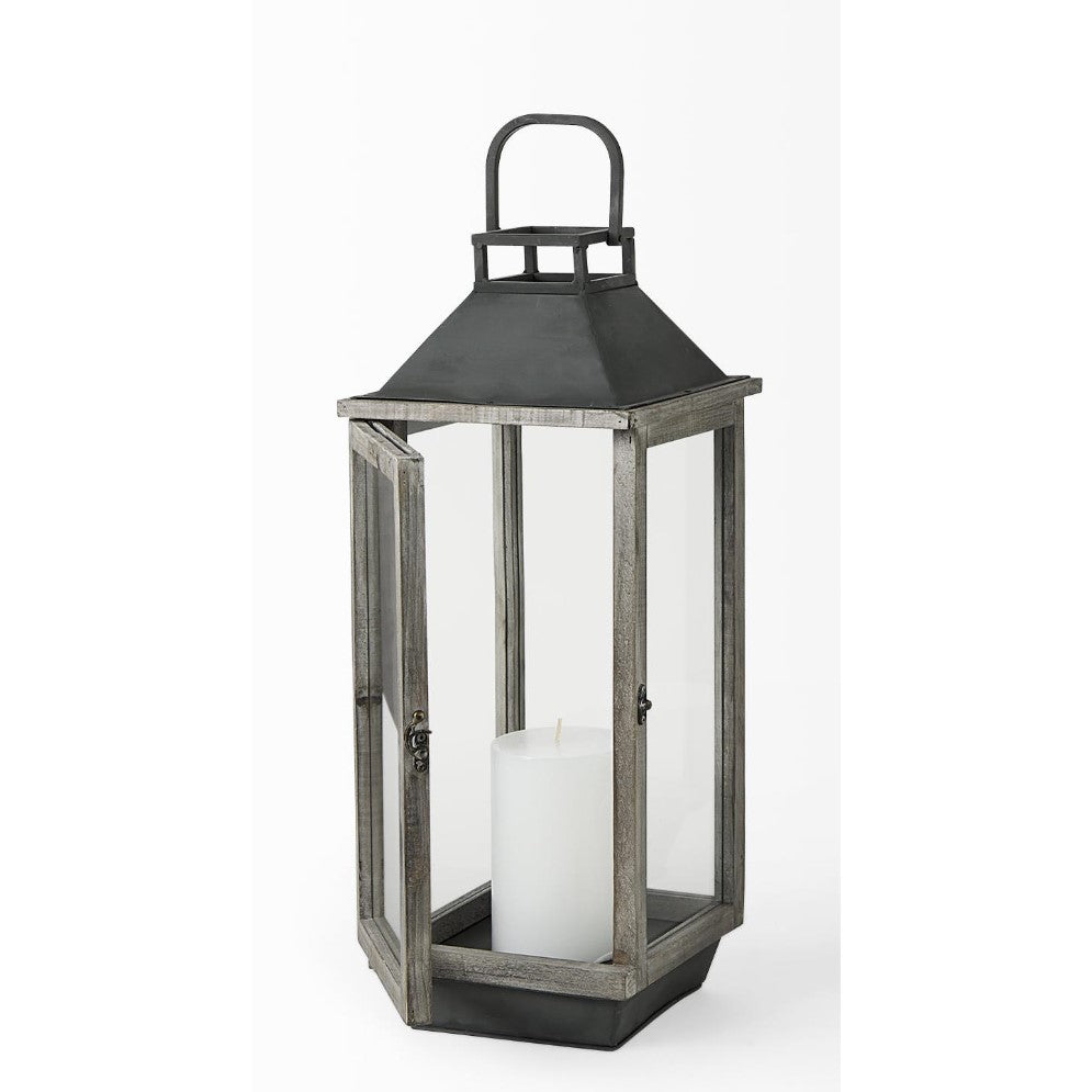 A rustic lantern with a white candle inside.