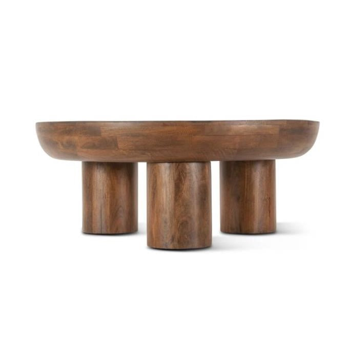Wooden table with three thick cylindrical legs.
