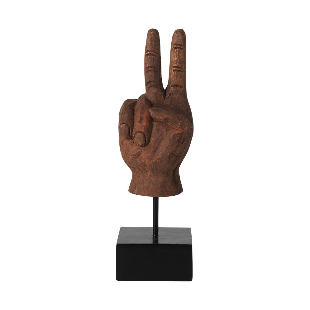 Wooden peace sign hand sculpture on a black stand.