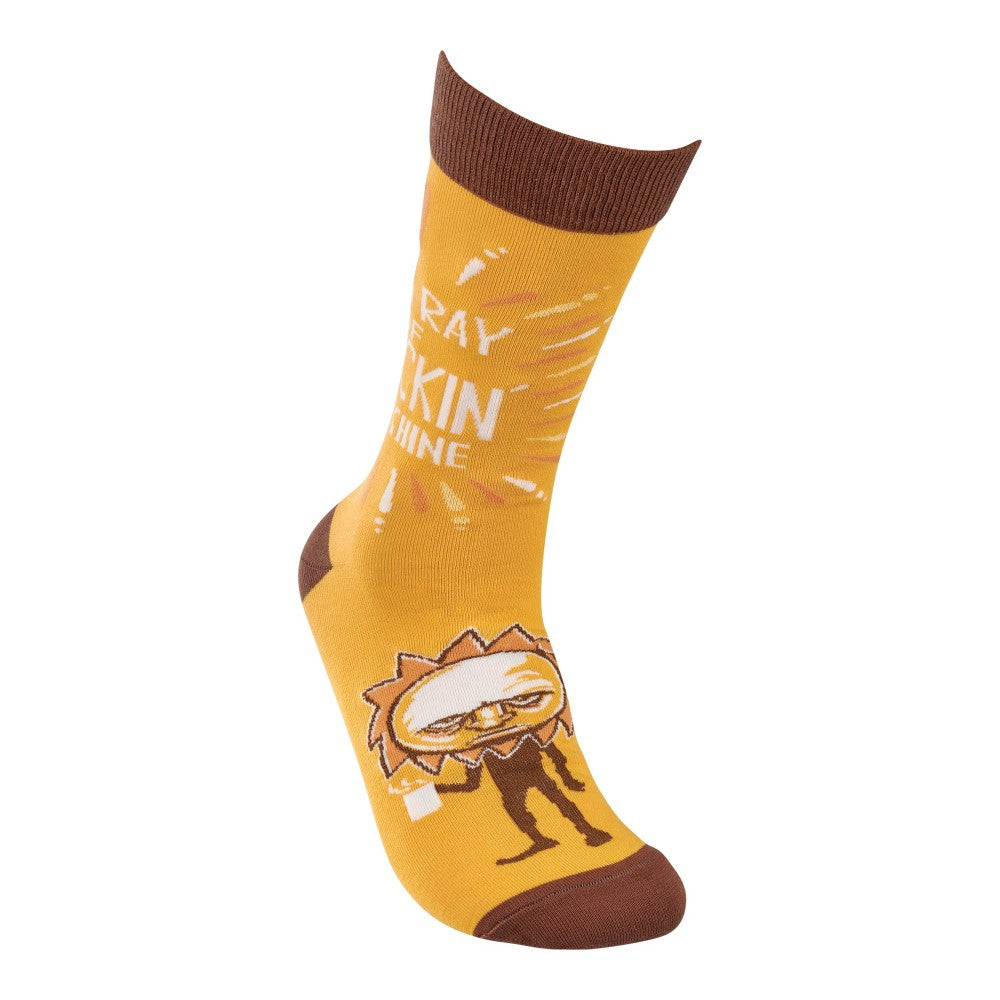 Yellow sock with a brown cuff and tips, featuring a cartoon sun and text.