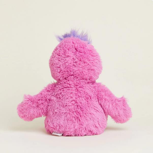 Pink plush toy with purple tuft, seen from the back.
