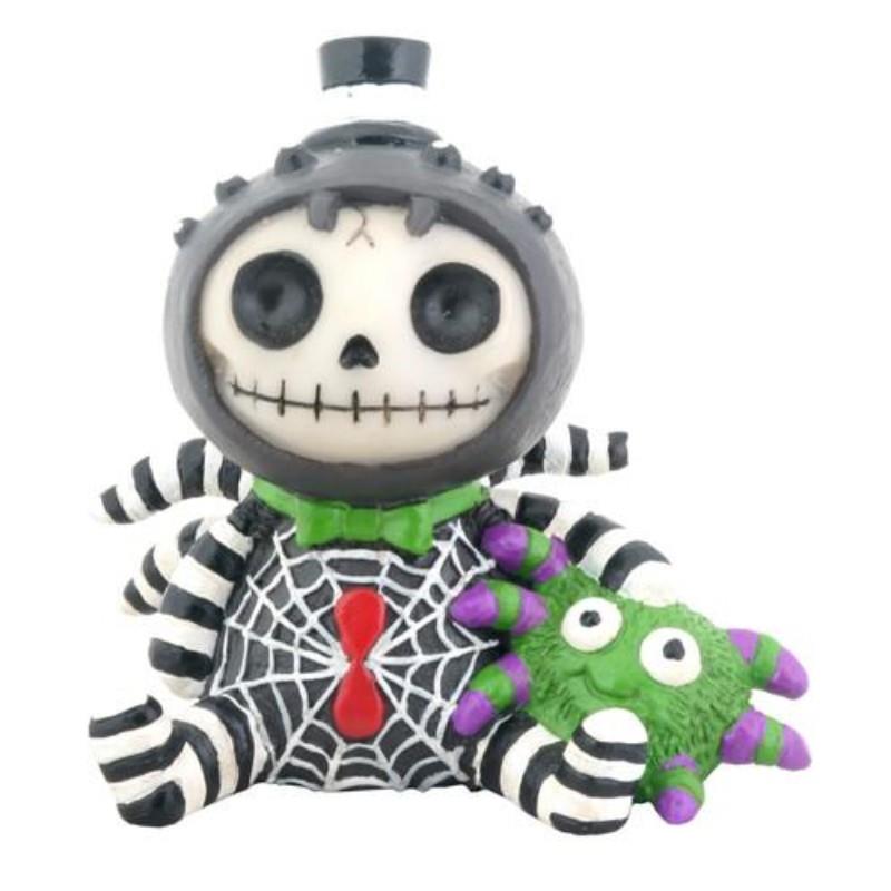 Cute skeleton figurine with striped legs, a spider design, and a green plushie.