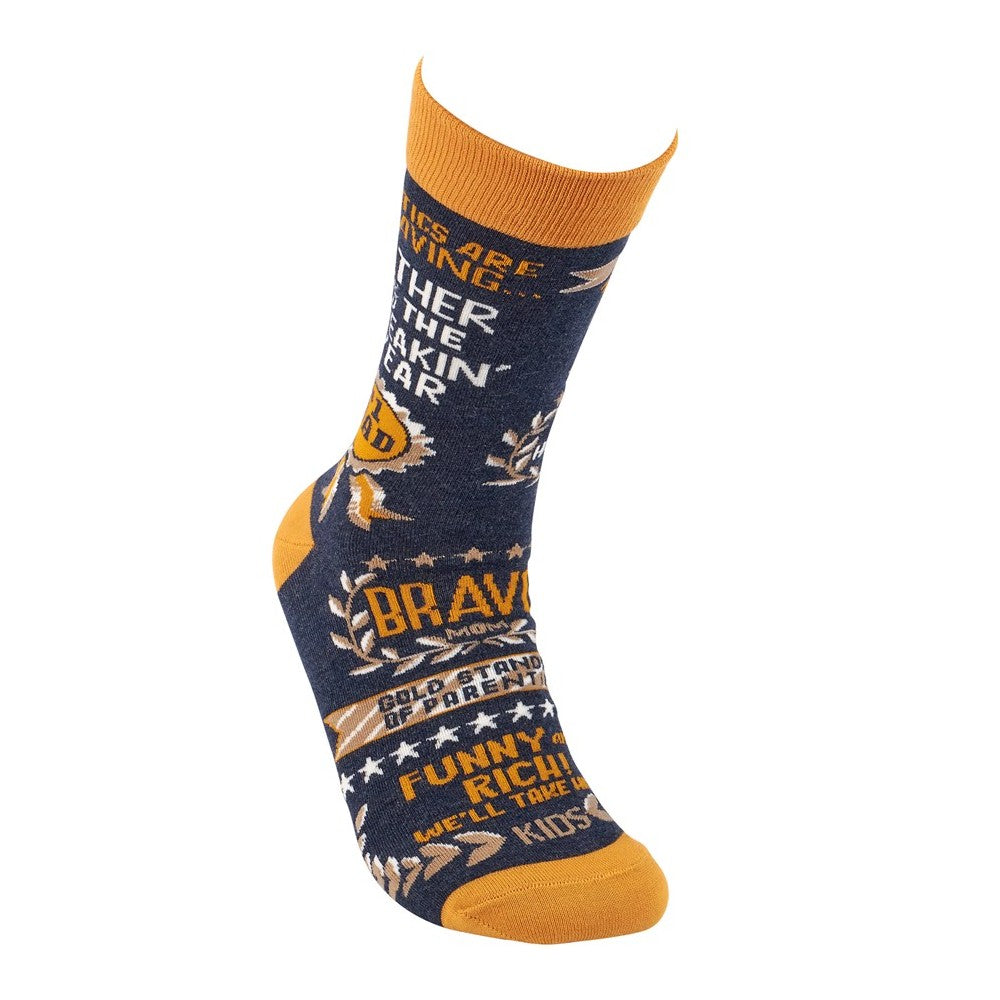 Colorful sock with bold text and patterns in blue and orange.