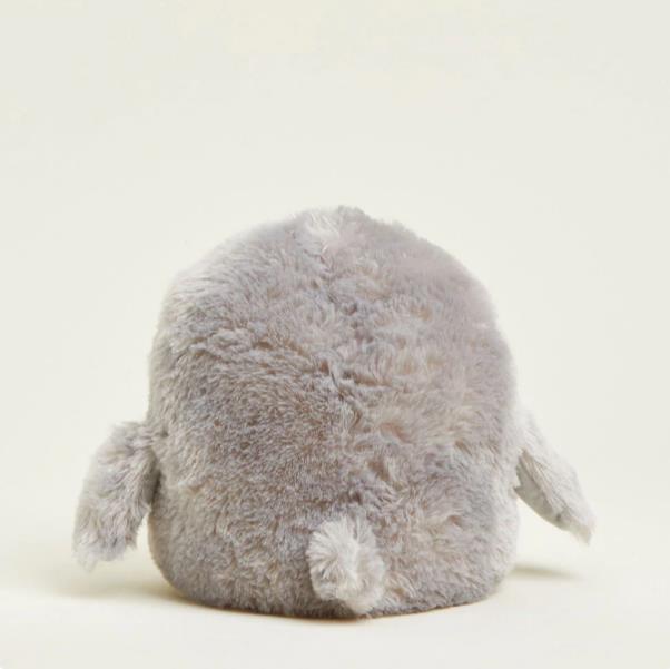 Fluffy, round, gray plush toy with tiny wings.