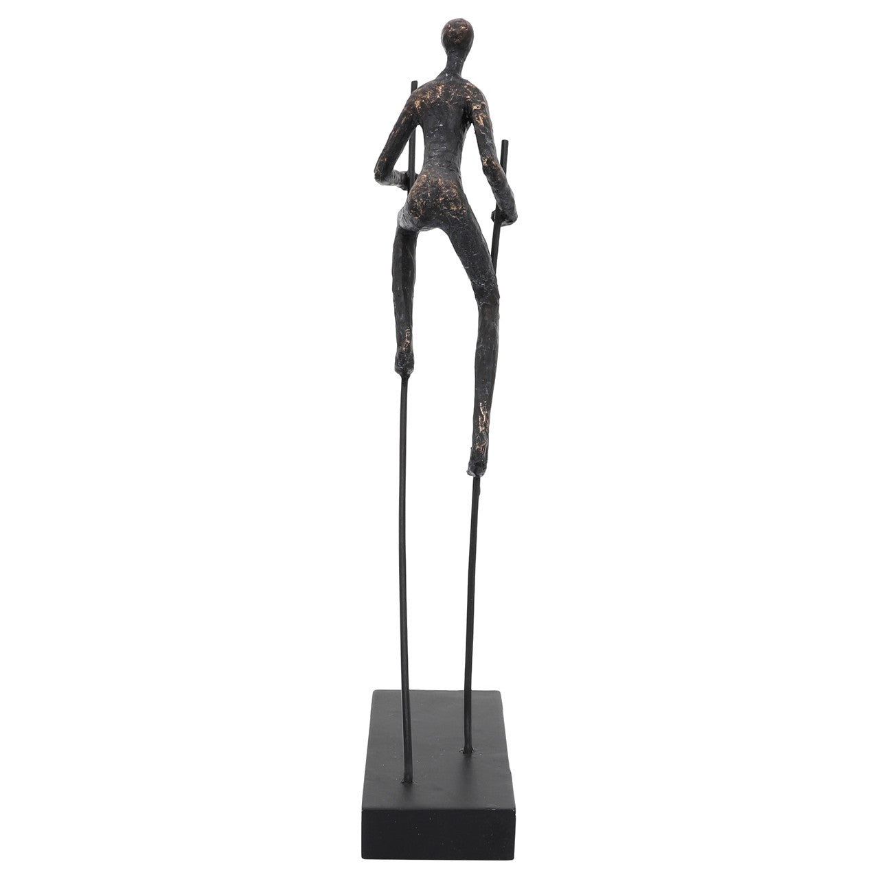 Bronze sculpture of a figure walking on stilts.