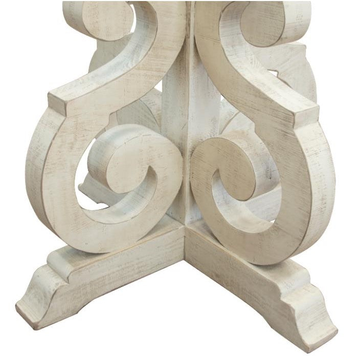 Intricate carved wooden base with scroll patterns.