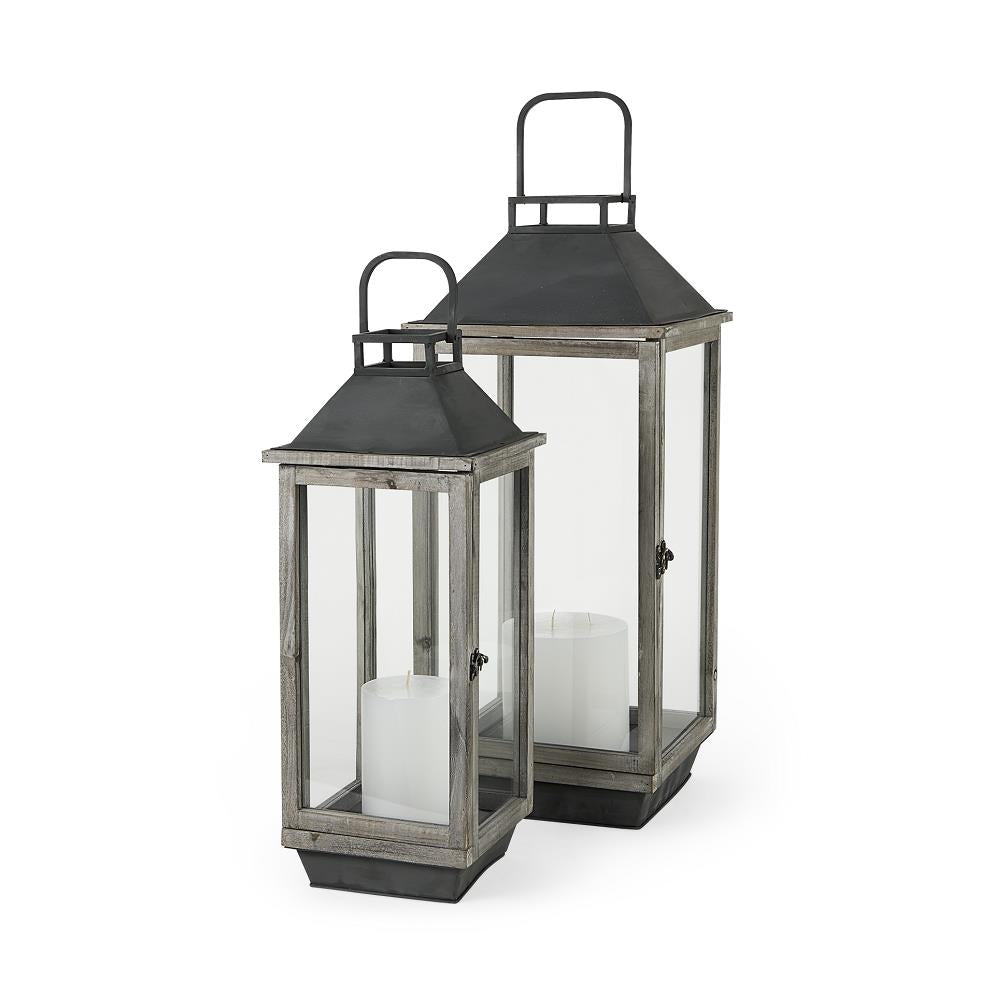 Two rustic lanterns with candles inside.