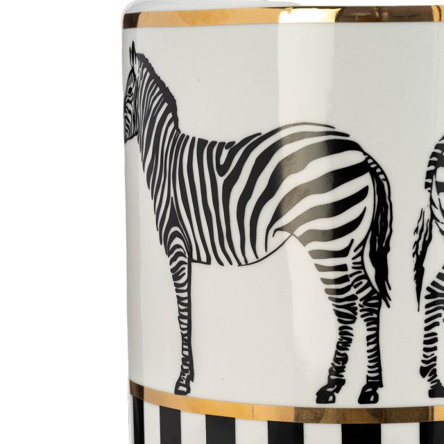 Zebra design on a ceramic vase with gold rim and stripes.