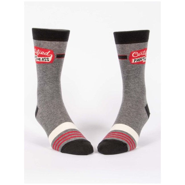 Gray socks with red stripes, humorous text: "Certified Pain In The Ass."