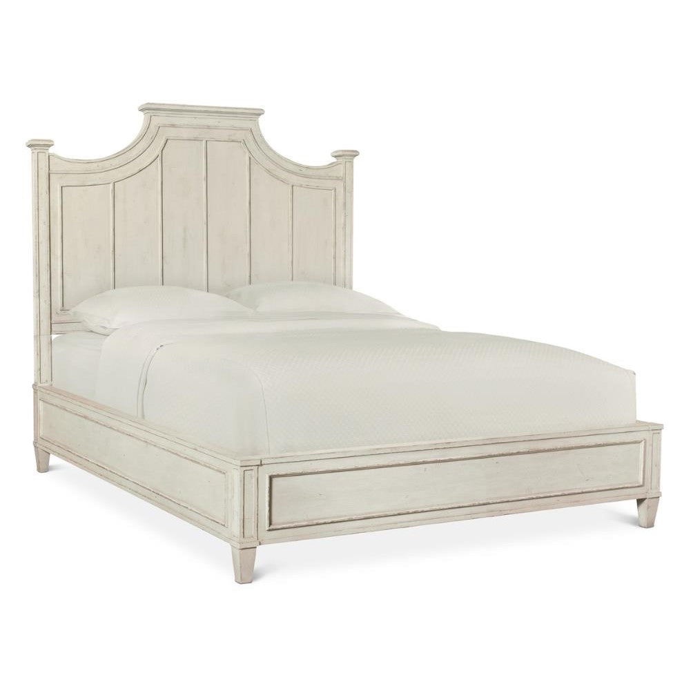 Vintage-style wooden bed with a high headboard and white bedding.