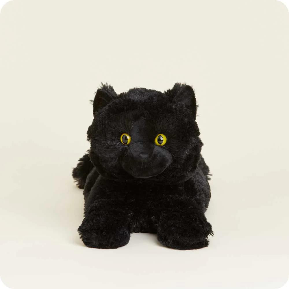A plush black cat with yellow eyes on a light background.