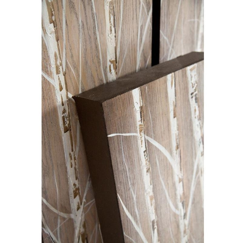 Wooden panel with painted white branches and tree patterns.