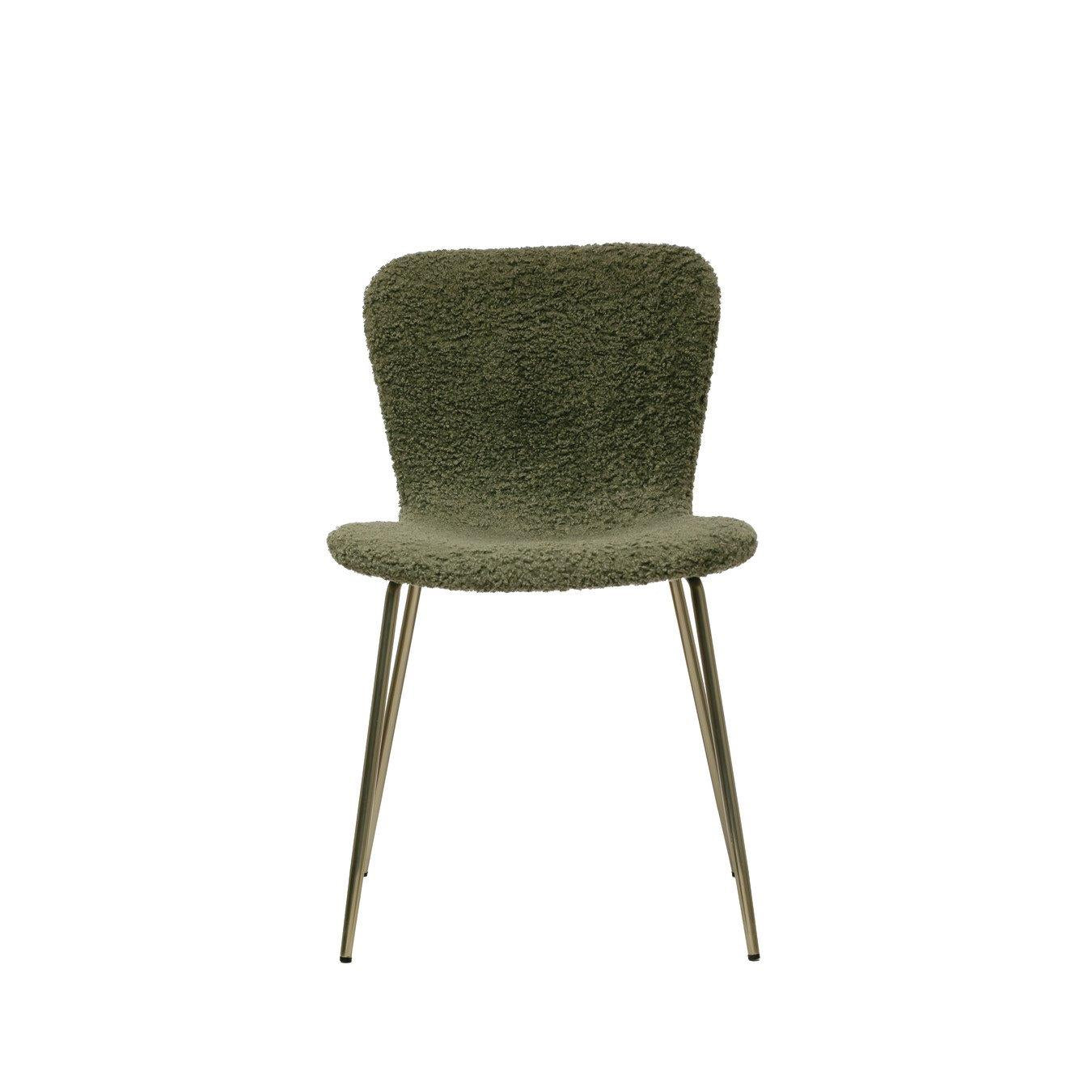 Green, fuzzy chair with sleek metal legs.