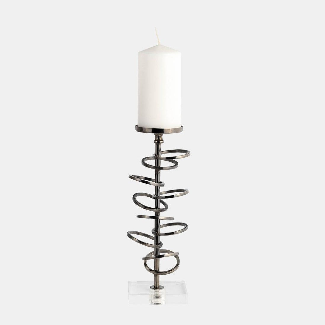 Modern candle holder with a spiral metal design and white candle.