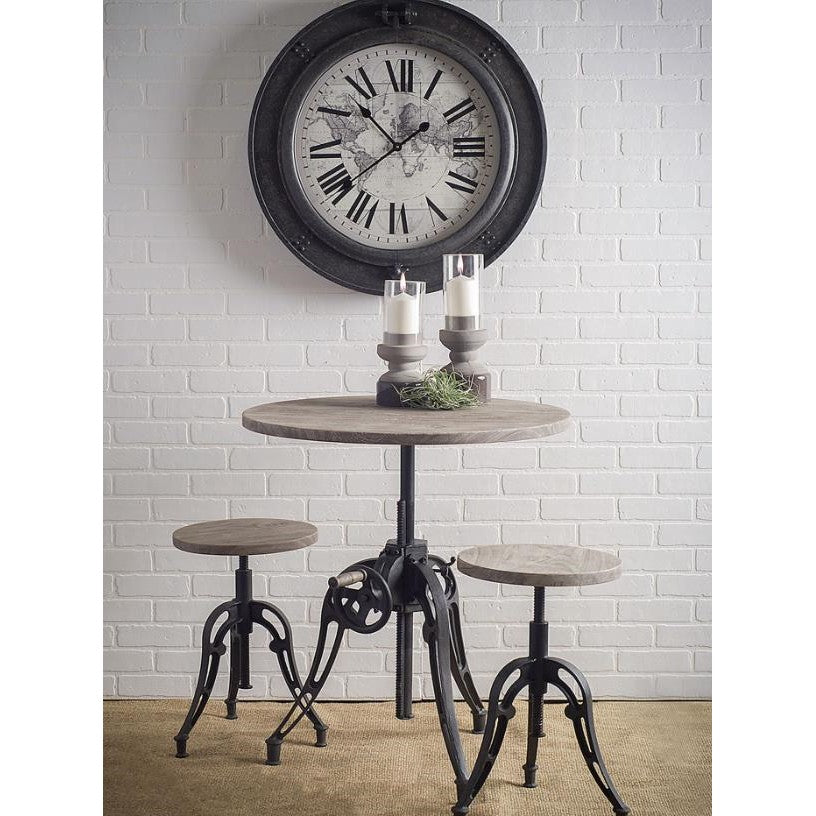 Rustic table set with industrial stools and a wall clock.