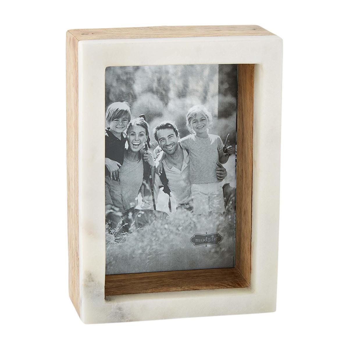Wooden frame with a black-and-white family photo.