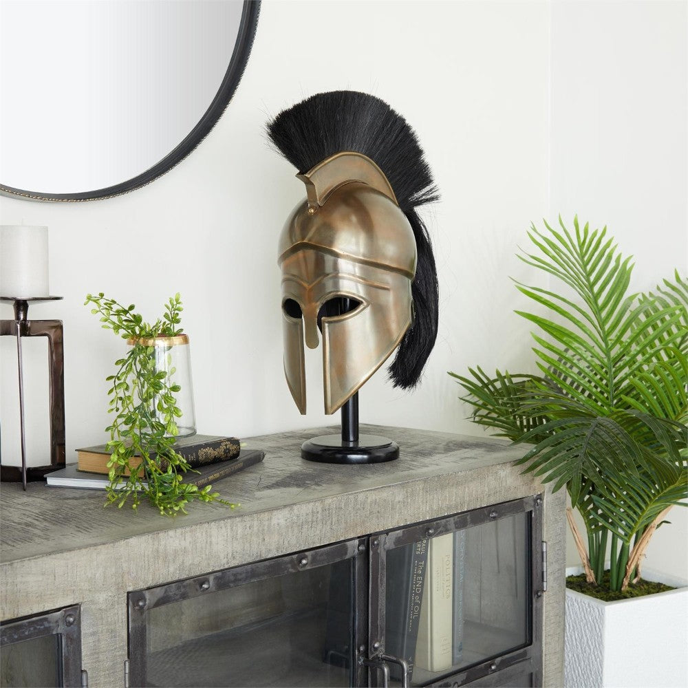 Bronze helmet on a stand, surrounded by plants and books.