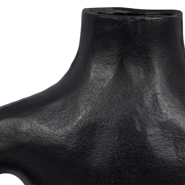 Textured black sculpture with smooth curves.